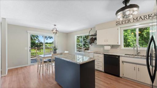 A large window above the sink brings in natural light, while the adjacent island provides extra prep space.