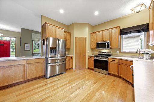 Spacious kitchen with pantry, year old stove, microwave and dishwasher