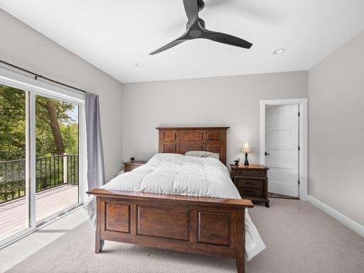 Primary suite has sliding doors to private deck