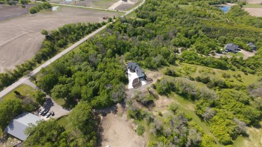 Overhead view of house, shop, and a some of the land - see the mowed pathways - it is parklike