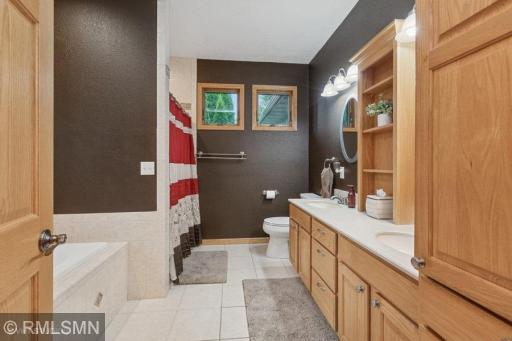 Primary bath with dual sink vanity, an abundance of cabinet space!