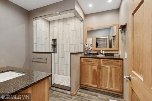Stunning 3/4 bath on the lower level with tiled shower and separate make up counter/vanity!