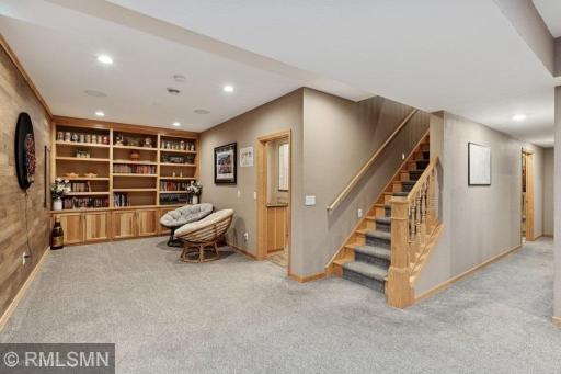 Lower level has a cute little reading/conversation nook with a wall of built ins!