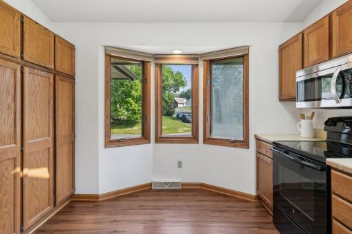Bright and functional kitchen with natural wood cabinetry, stainless steel appliances, and a skylight that fills the space with natural lightâperfect for everyday cooking and entertaining.