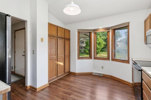 Bright and functional kitchen with natural wood cabinetry, stainless steel appliances, and a skylight that fills the space with natural lightâperfect for everyday cooking and entertaining.