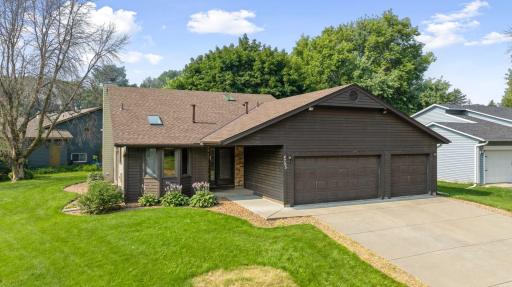 Exterior highlights include a new roof installed in 2024, a spacious heated three-car garage, and a generous corner lot offering plenty of outdoor space.