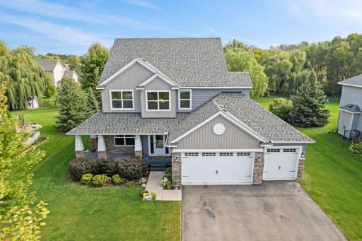 Welcome to this beautifully maintained two-story home, perfectly situated on a spacious lot with mature trees. Front wrap around porch!