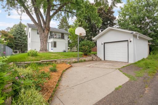 Parking pad offers off-street parking and a great spot to shoot some hoops