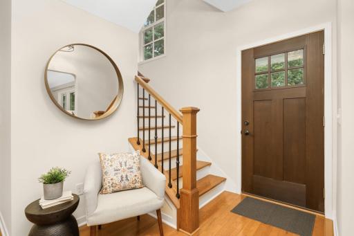 Spacious foyer welcomes you home and offers plenty of storage in a huge understair closet