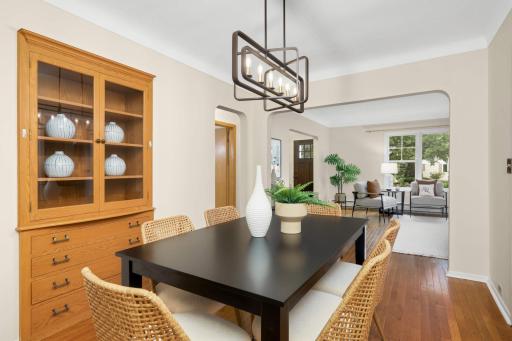 Dining room with original built-in sits between the living room and family room