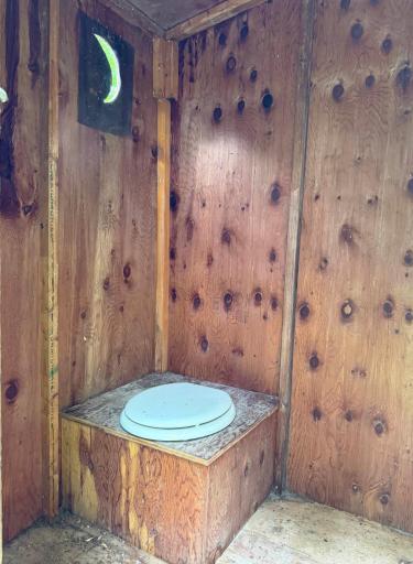 Taking a look inside the second outhouse.