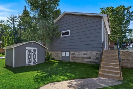 Storage shed between home and behind garage