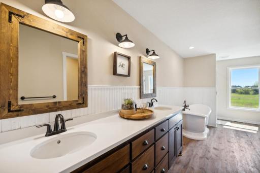 Uncluttered and calming, the primary bath feels like a private spa retreat.