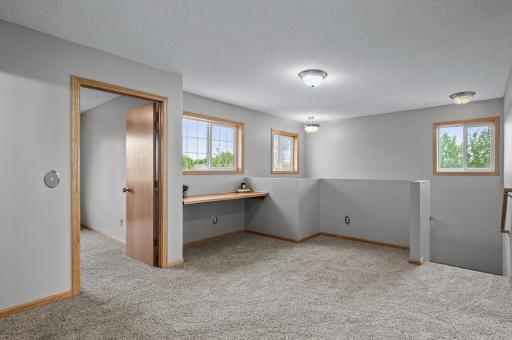 Upstairs, between the 3 bedrooms, you’ll find this loft area with a built in counter.