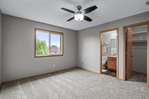 Primary bedroom has a view of the backyard.