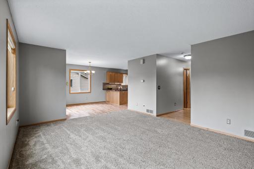 Living room walks into the dining room and kitchen.