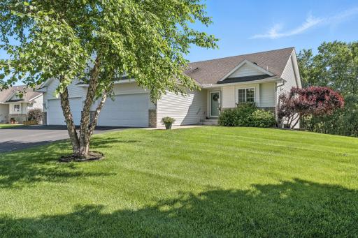 Gorgeous end unit townhome complete with main level living plus an unfinished lower walkout lower level.