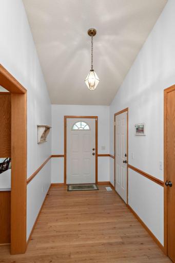 Spacious front entry, next to garage entrance, near closet and kitchen.