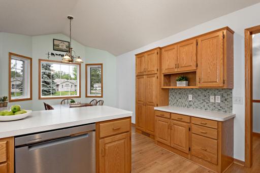 Spacious kitchen includes more storage, work space, and eating area.