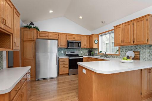 Lots of storage and stainless steel appliances, as well as room for seating at the peninsula.