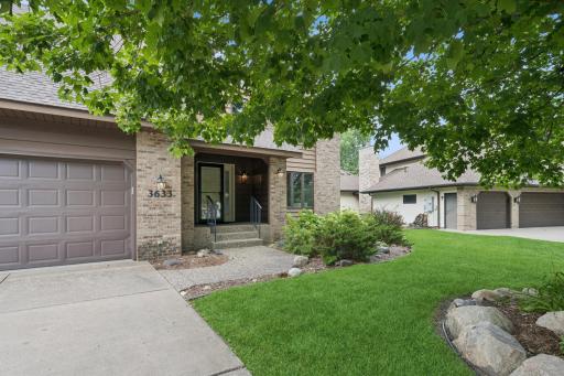 The home backs up to the Vadnais - Snail Lakes Regional Park, is close to neighborhood trails and offers easy access to highways and the city.