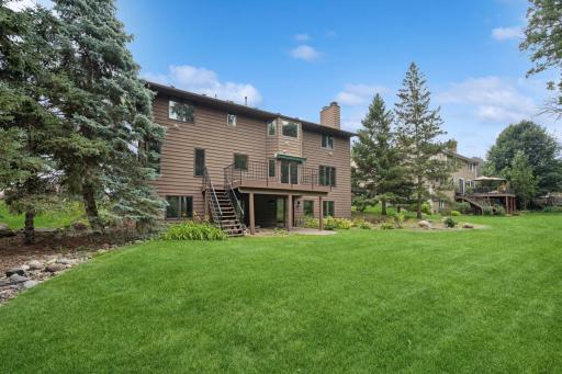The large flat backyard has space to garden and play games.