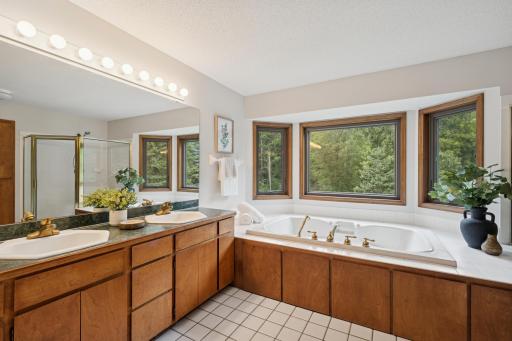 5 piece primary bathroom has dual vanity and large soaking tub