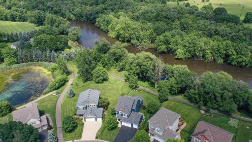 WOW!! This Spectacular Riverfront Executive Walkout 2 Story will truly Amaze you! 85' of River Frontage on Crow River with Private Views of Crow Hassan Park Reserve with a fully fenced back yard - lots of privacy!!