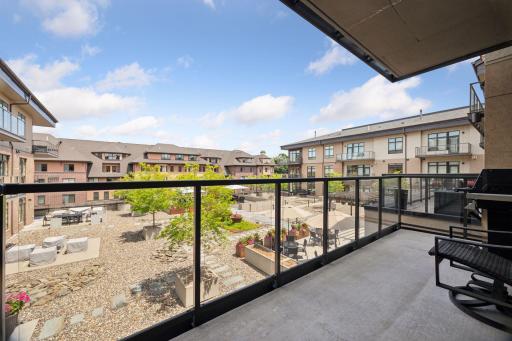 The smaller balcony has a built-in gas grill and room for a small table and pair of chairs.