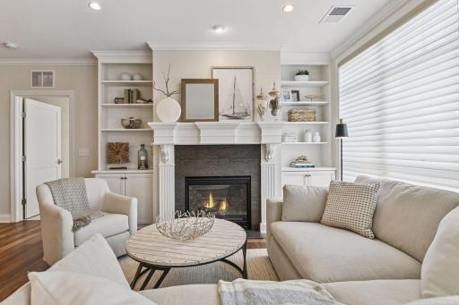The family room has gas fireplace and a mantel with an outlet and wiring for hookup of a TV.