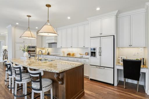 There is abundant cabinetry and a planning desk.