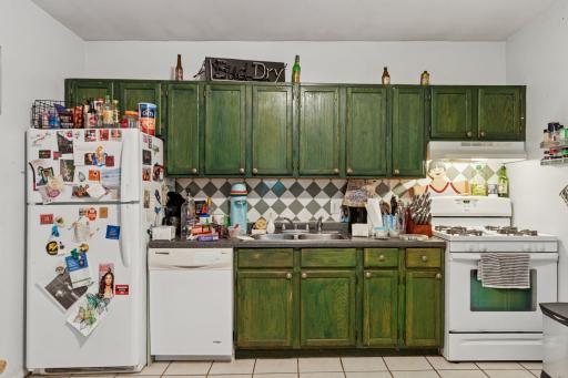 120 14th Avenue Northeast - Kitchen with full size refrigerator, gas range and dishwasher.