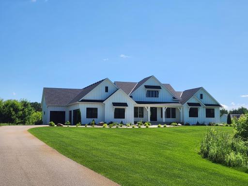 This beautiful modern farmhouse was custom built in 2021, features 2 main floor suites, and is located on 6.56 acres with an in-ground saltwater pool. *Professional photos will be added 7/23/2025.*