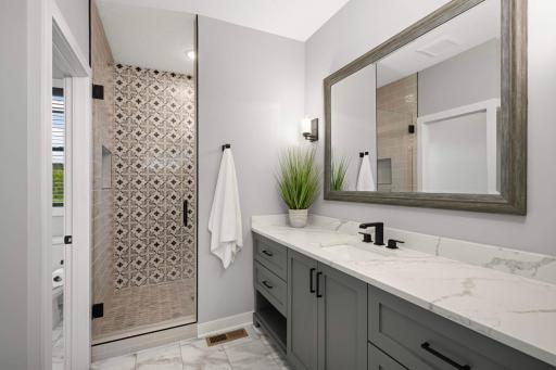 This beautiful private Â¾ bathroom features: a tiled walk-in shower with glass door, water closet, and large walk-in closet.