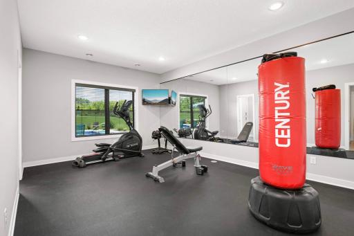 Your own dedicated workout space/yoga room complete with rubber floor to lower impact and a mirrored wall.