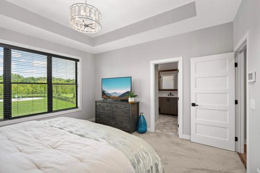 Notice the white paneled doors throughout the house. You will find a 3/4 private bathroom attached to this bedroom.