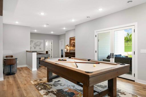 Great gaming area! Space for a pool table, shuffleboard table and other table top games. Straight ahead are bedrooms 4 & 5 and a 3/4 bathroom.