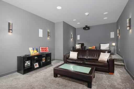 This theater room is the perfect space for movie night or to watch the big game.