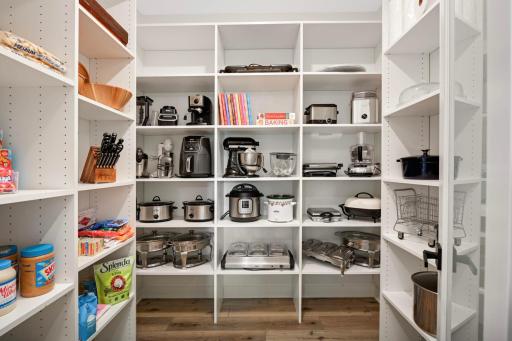 8'x7' walk-in pantry with wood shelves is large enough to hold your food AND small appliances!