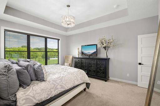Both main floor bedroom suites have back yard views.