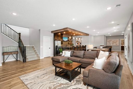 The lower level is an entertainers dream with huge amusement room, wet bar, gaming areas, theater room AND it walks out to the pool!
