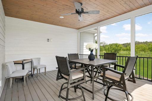 17'x14' screen porch overlooks the saltwater pool, is located off the kitchen, and is another great space for dining or relaxing away from the mosquitos. Notice the outlet on the wall to add a TV.
