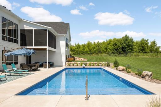 This pool measures 20'x50', is 3' deep on this end and 8' deep pm the other end. Notice the serene privacy.