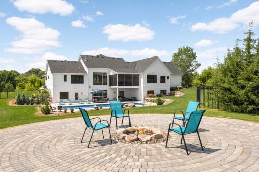 At the back of the fenced part of the lot is this paver firepit.