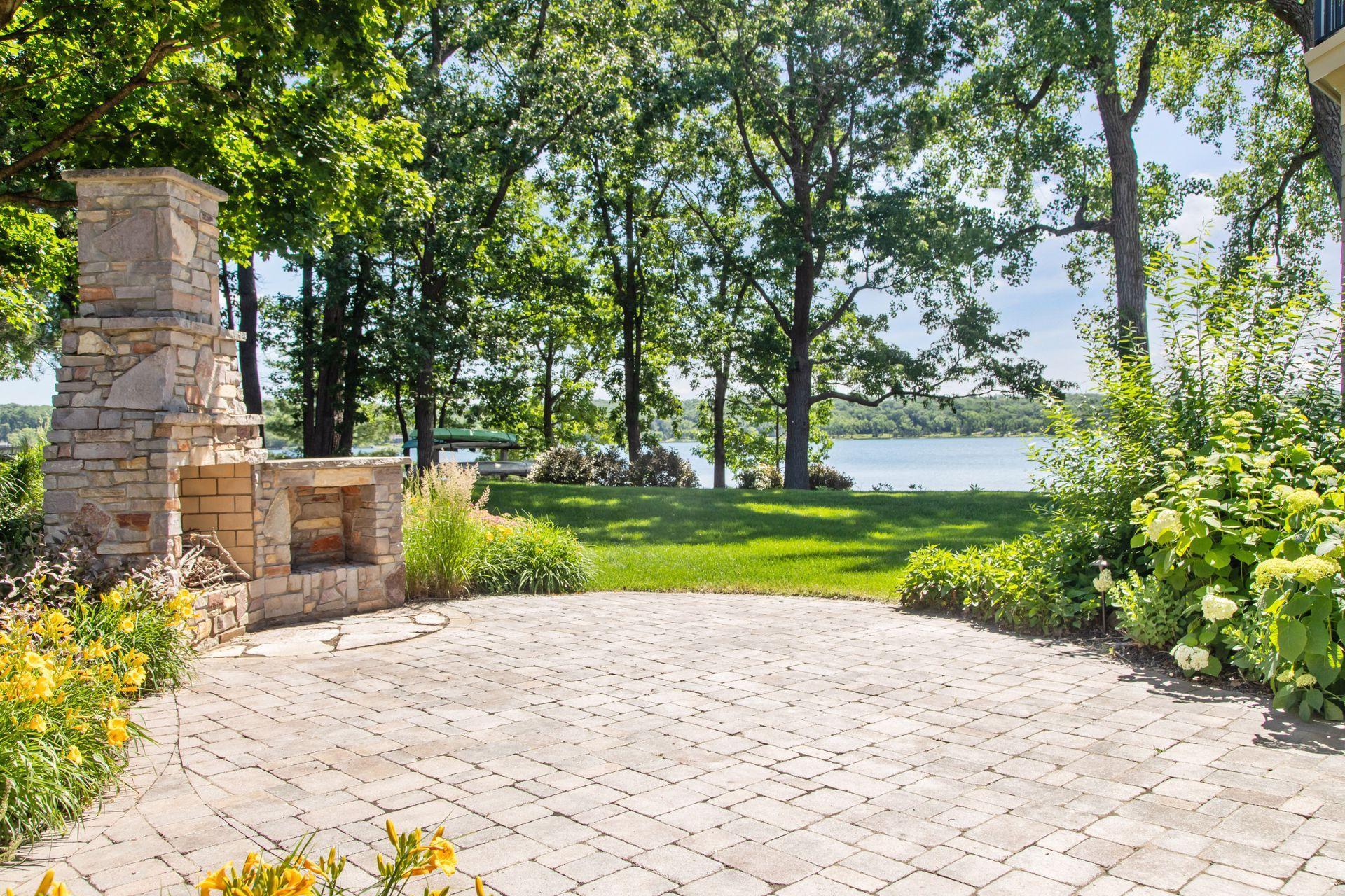 Outdoor fireplace with water fall and patio