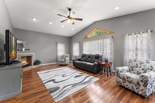 Great room has vaulted ceiling, plenty of windows and electric decorative fireplace!