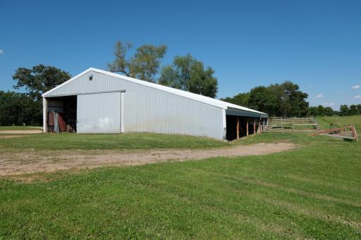 Farm Shed for Storage: 40' x 62' - storage area (32' x 40') with dirt floor - 30' x 40' heated shop area with concrete floor - south end open to pasture