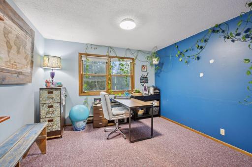 Bedroom 4 is also being used as an office space. This room overlooks the front of the house.