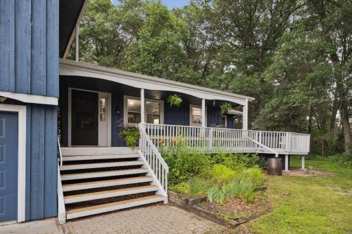 The lovely covered porch includes a built in bench and was refinished last summer.