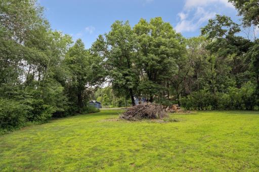 A cleared area on the South side of the driveway offers a great spot for those large bonfires!